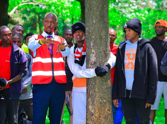 File image of 14-year-old Stephen Gachanja with Geoffrey Mosiria.